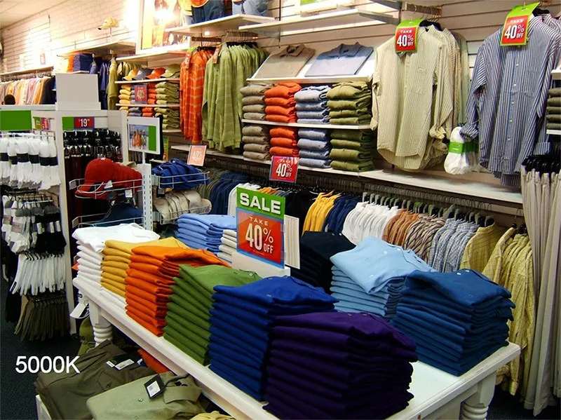 Retail store under NaturaLux full-spectrum lighting showing accurate fabric and merchandise color rendering