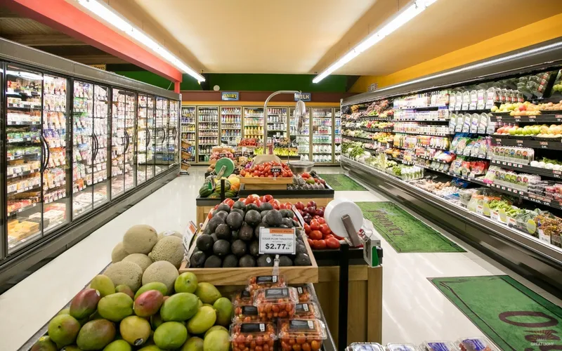 Harsh overhead fluorescent lighting in a retail store causing glare on merchandise